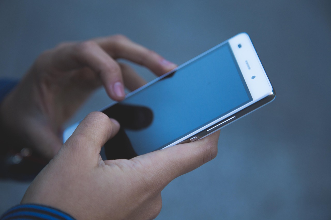 Hands using smartphone